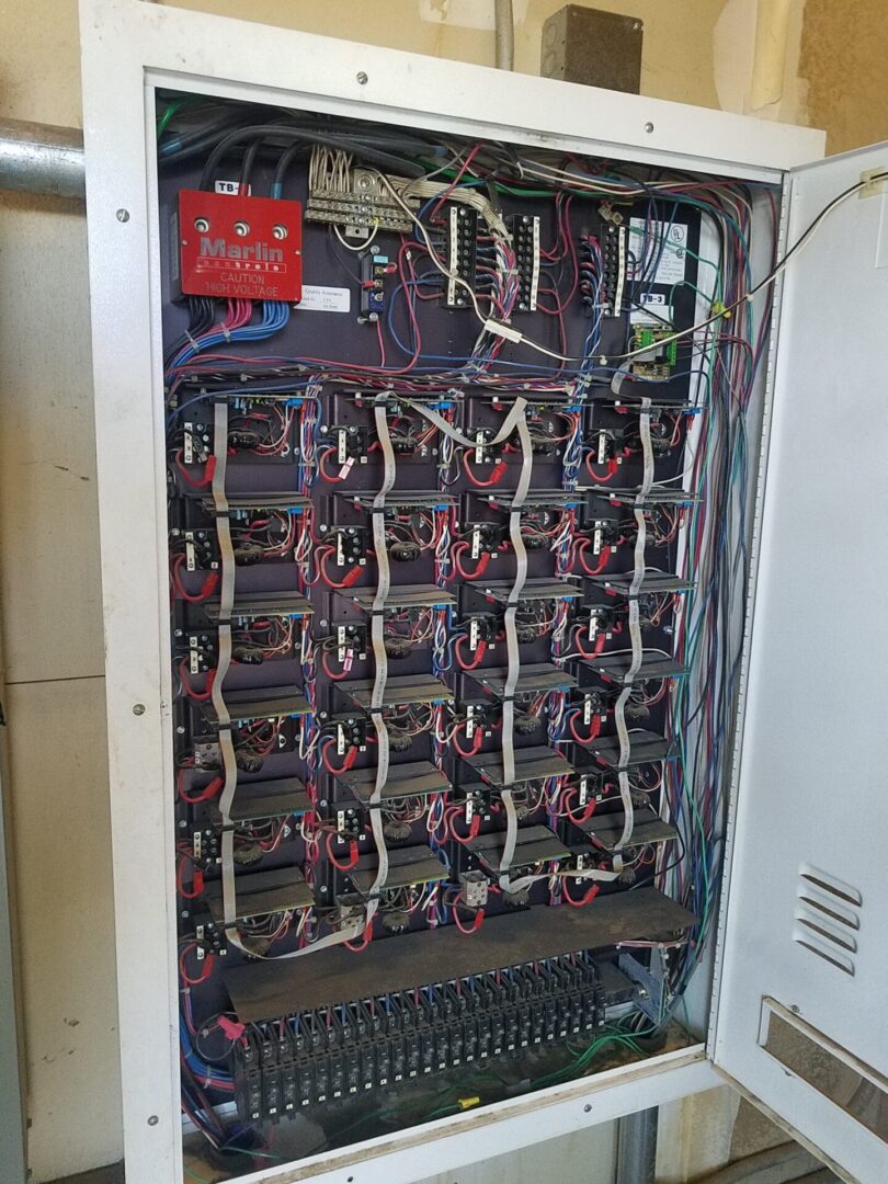 A bunch of wires are connected to the back of an electrical box.